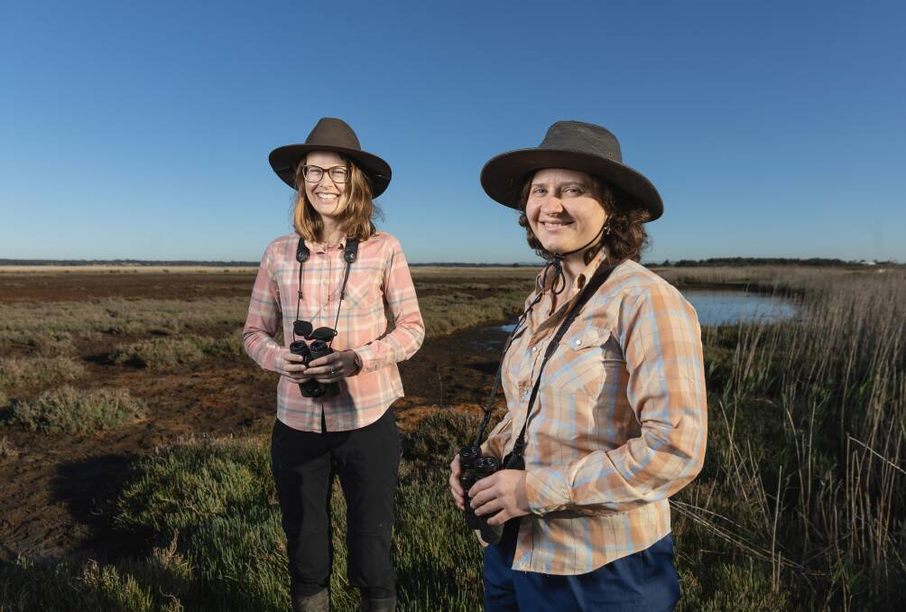Louise Williams and Mattea Taylor research birds in the Hunter Wetlands National Park.  Picture by Marina Neil.